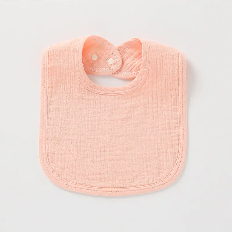 Joli bavoir rose ajustable en mousseline de coton
